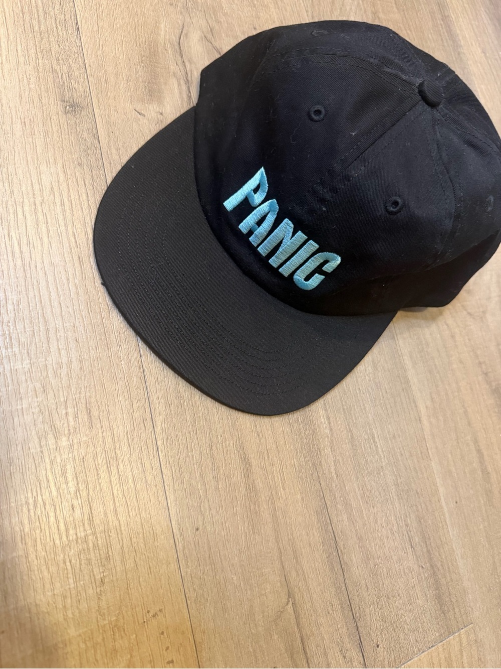 Black Hat with Teal PANIC Embroidery